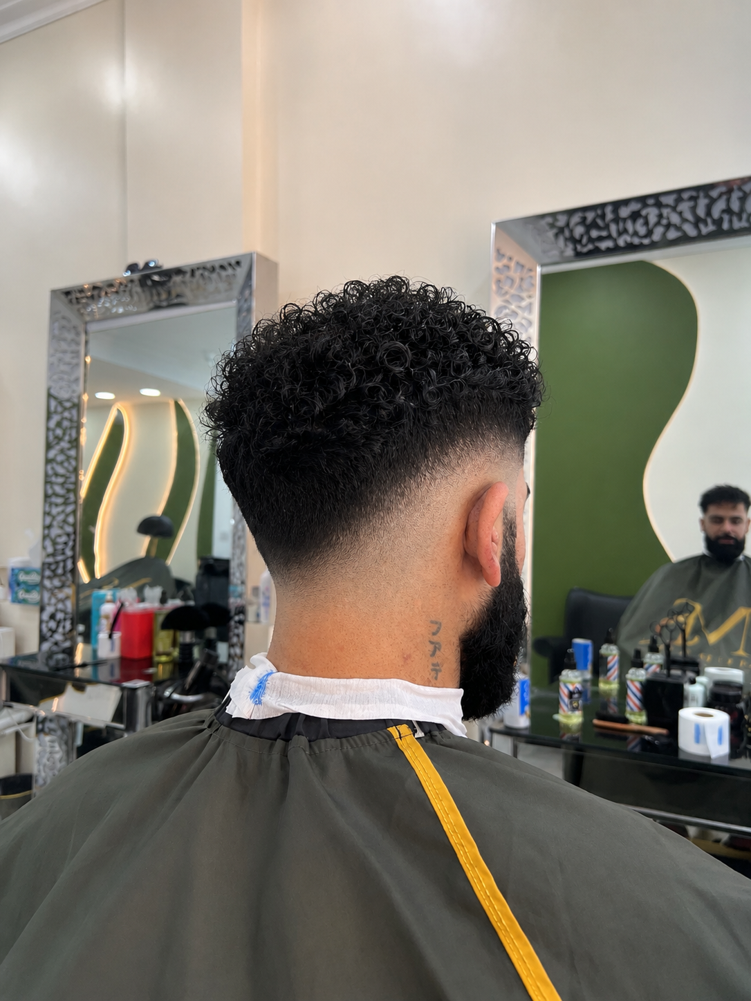 Curly haircut with fresh fade at Murad’s Salon